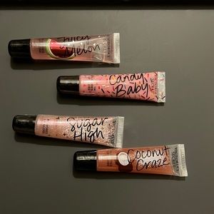 4 BRAND NEW SEALED Victoria’s Secret lip gloss